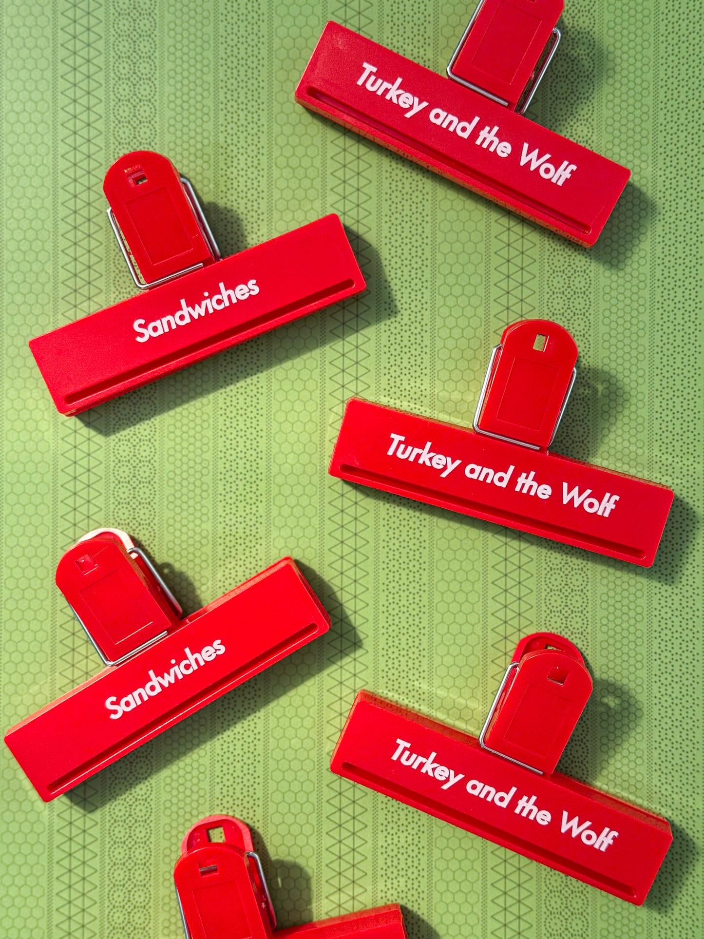 Red clips with 'Sandwiches' and 'Turkey and the Wolf' labels on a green background
