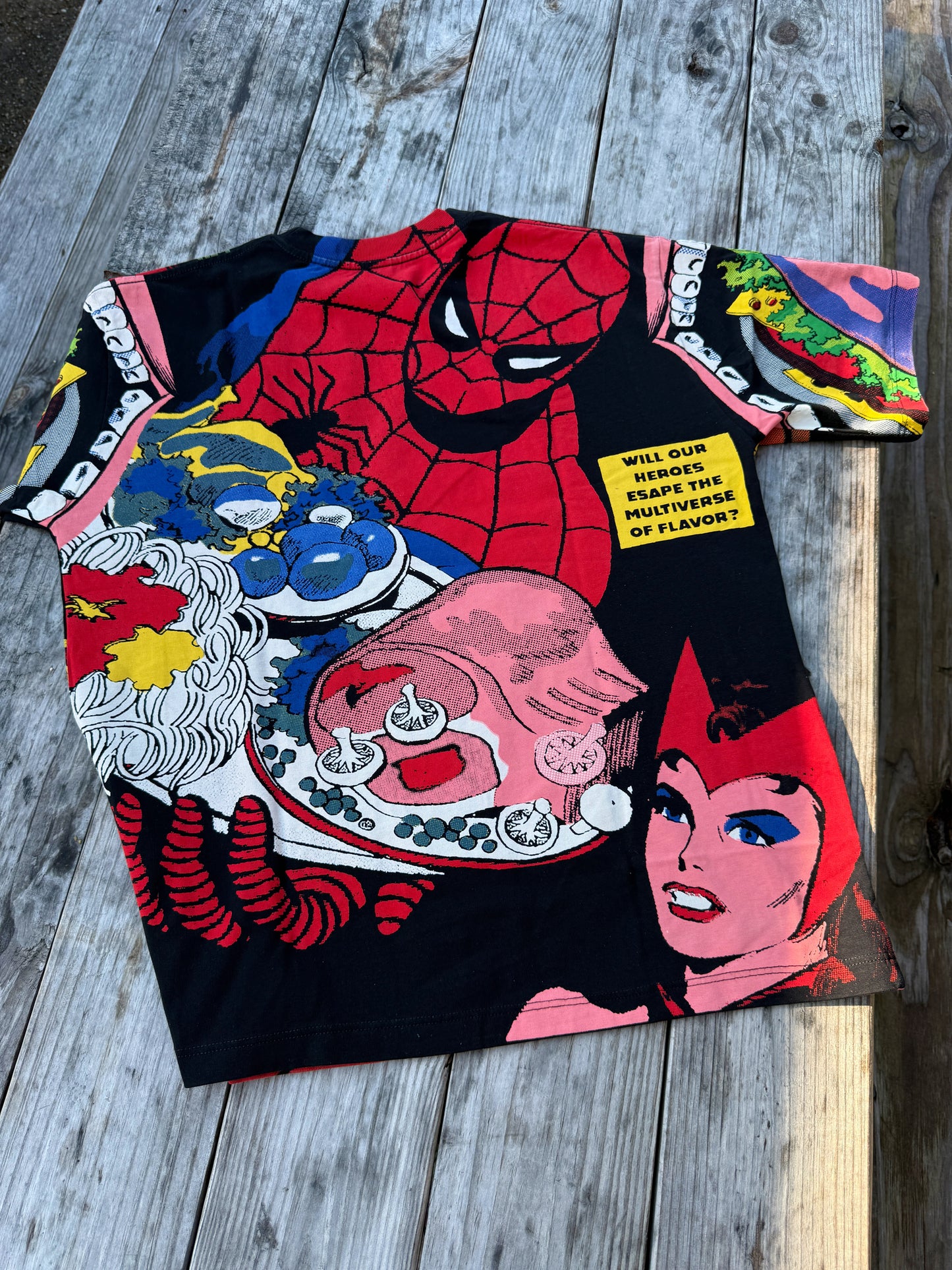 Colorful t-shirt with graphic design on a wooden surface